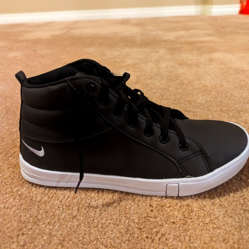 Black Nike shoes with white trim